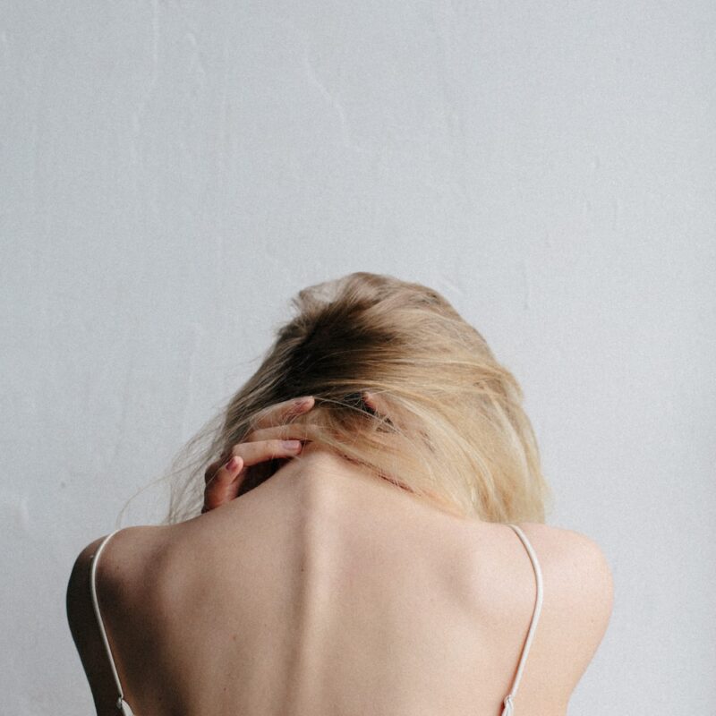 a girl with neck pain