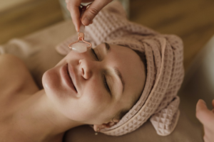 A woman getting a facial massage