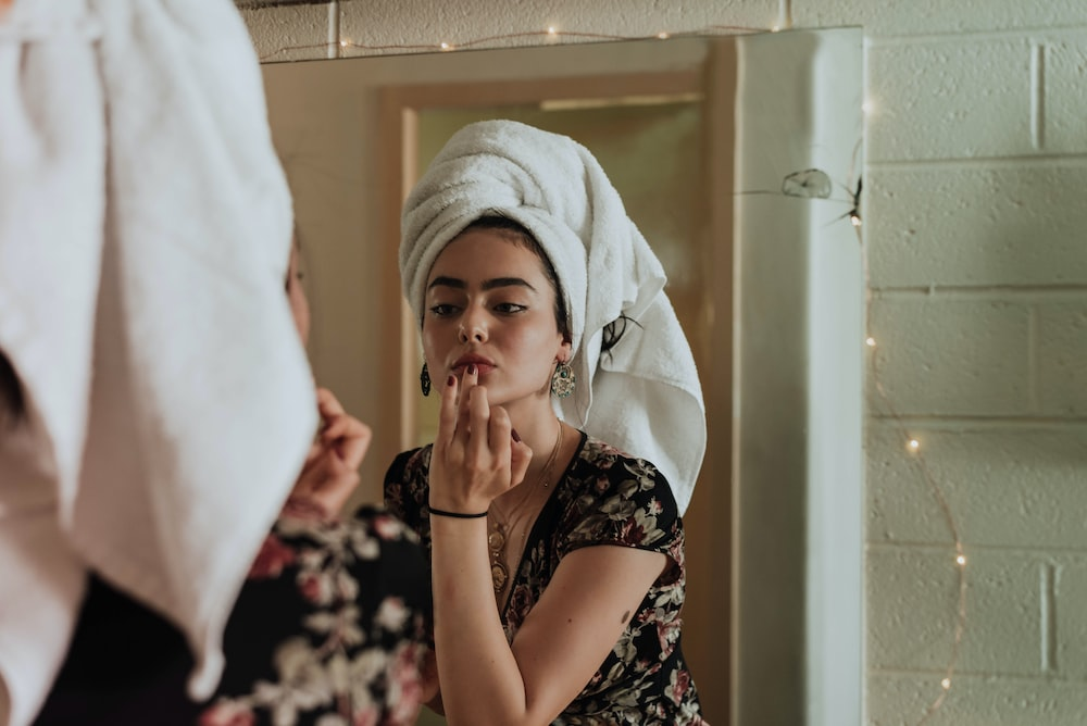 a woman doing skin care. 